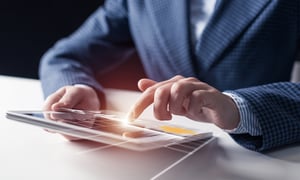 bigstock-Businessman-Hands-Using-Tablet-299127130