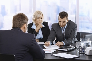 bigstock-Businessteam-Reviewing-Documen-10731038