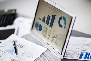 bigstock-analyzing-investment-charts-wi-82252127