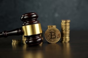 bigstock-Auction-Gavel-And-Bitcoin-Cryp-314391931